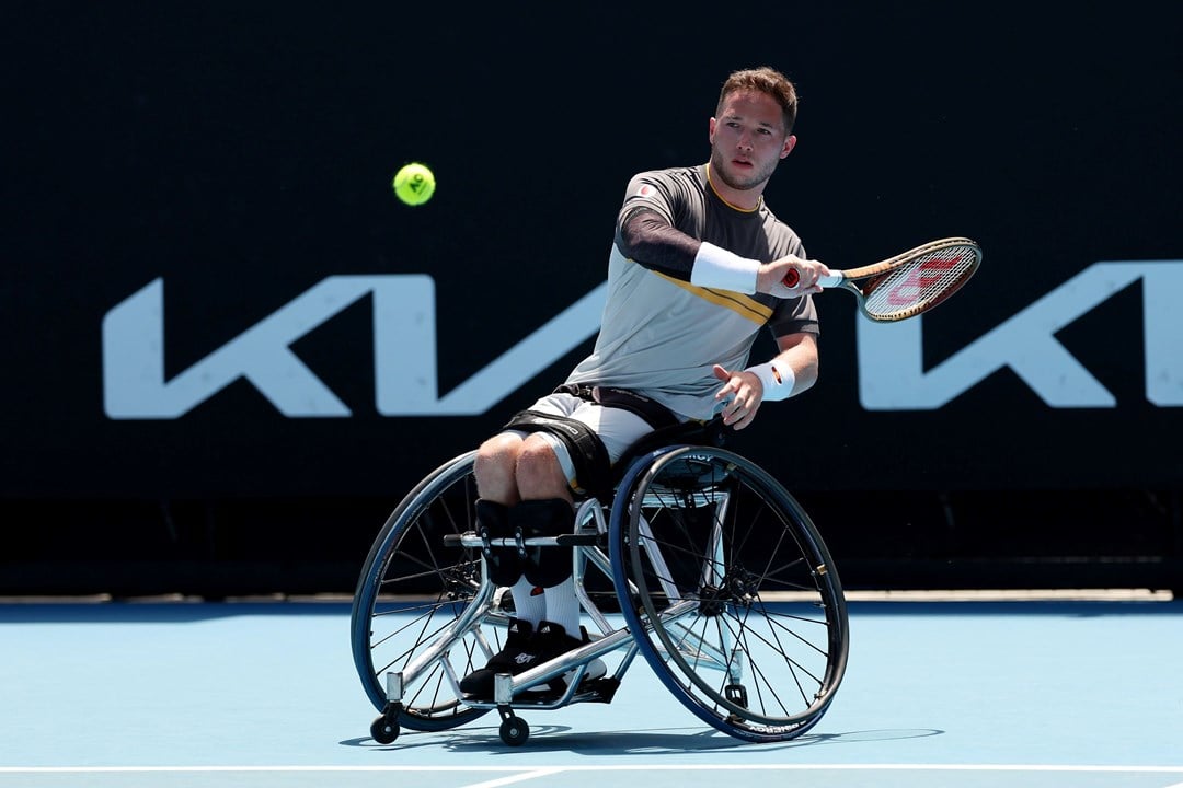 Alfie Hewett sat in his wheelchair while hitting a forehand on court at the Australian Open