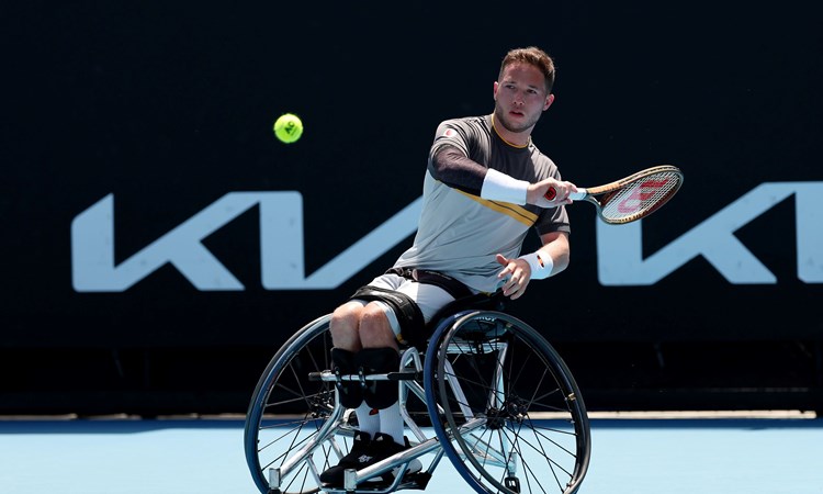 Alfie Hewett sat in his wheelchair while hitting a forehand on court at the Australian Open