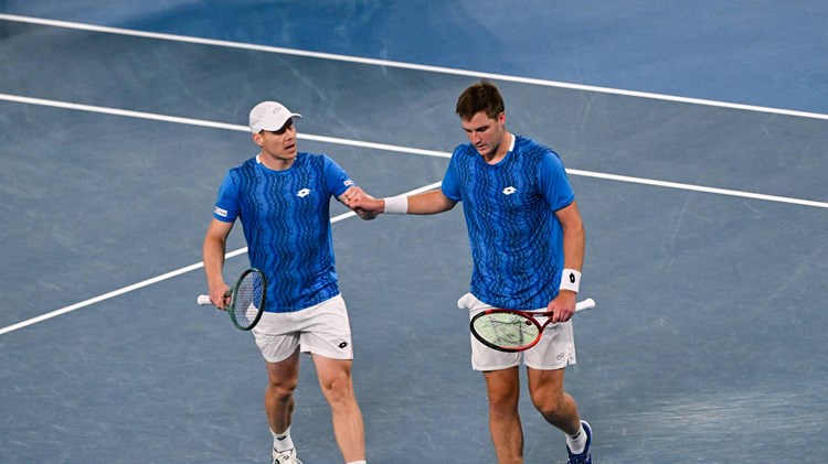 Harri Heliovaara and Henry Patten fist bump in the Australian Open men's doubles final
