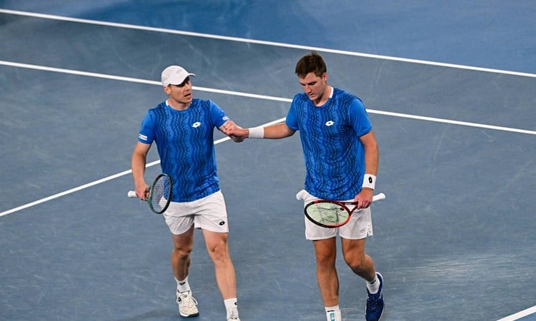 Harri Heliovaara and Henry Patten fist bump in the Australian Open men's doubles final
