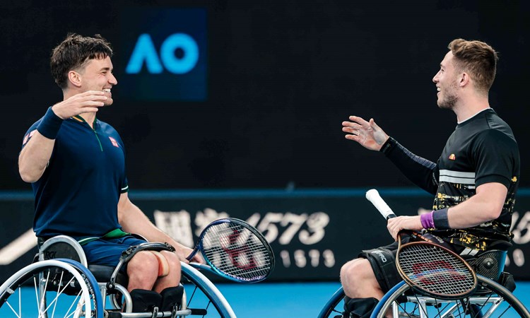 Alfie Hewett and Gordon Reid shaking hands on court after lifting their 5th successive Aus Open wheelchair doubles title