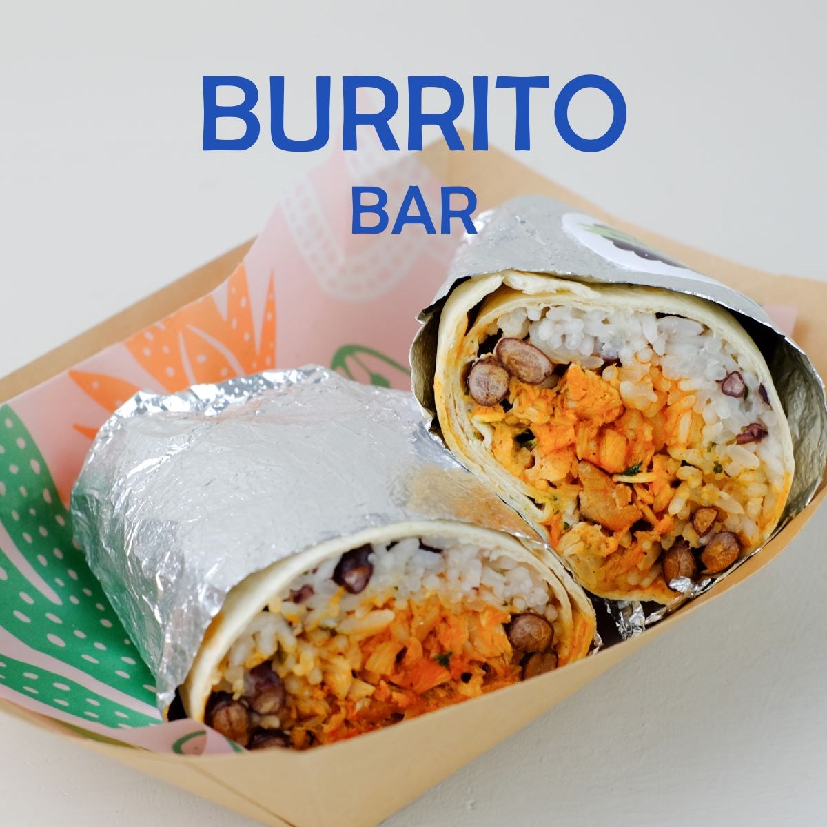 A takeaway burrito wraped in foil from Burrito Bar