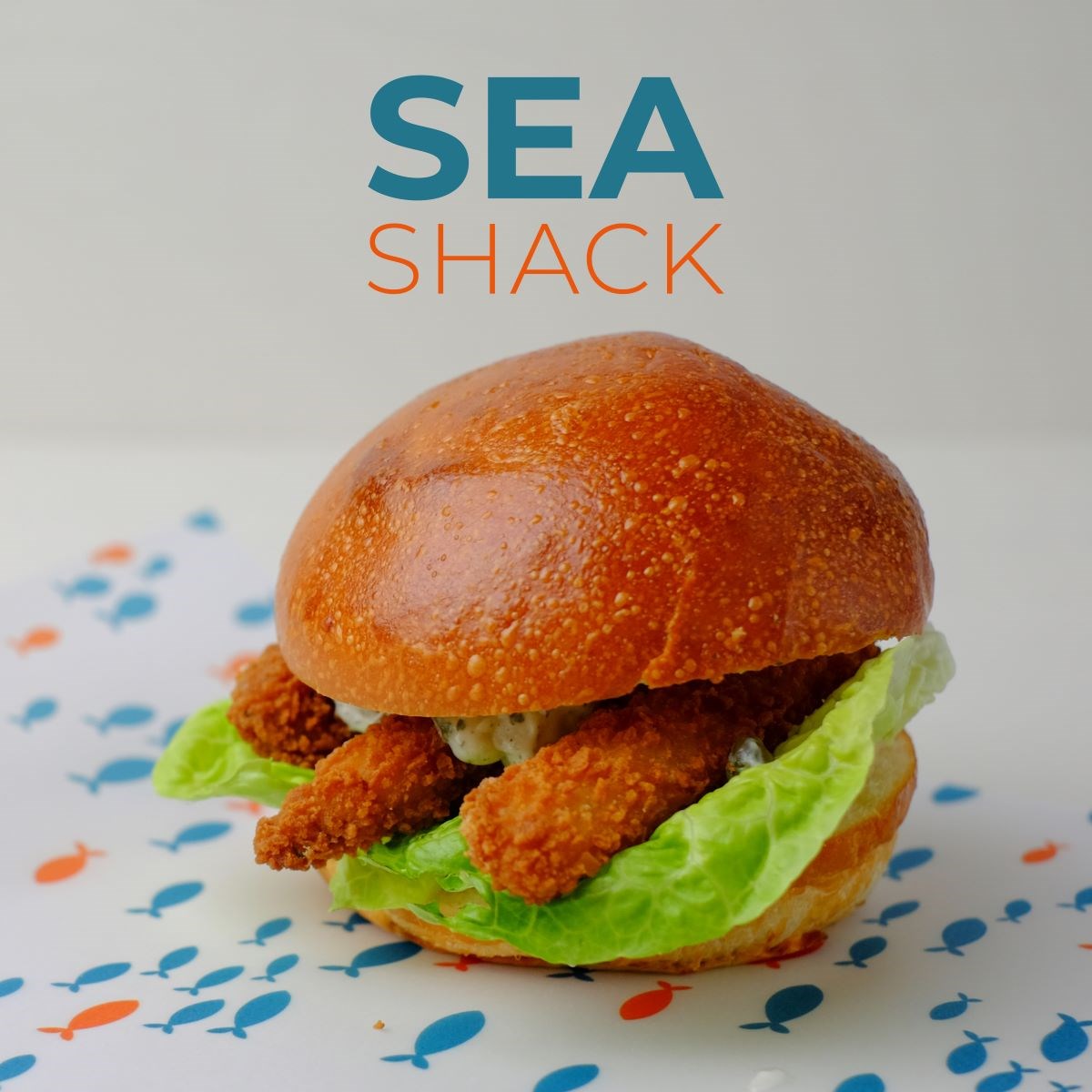 A fish sandwich with lettuce from Sea Shack