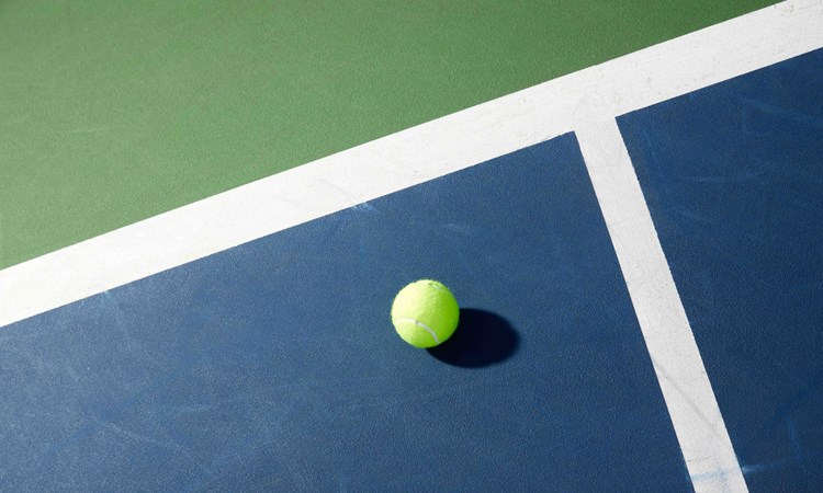 Tennis ball on court