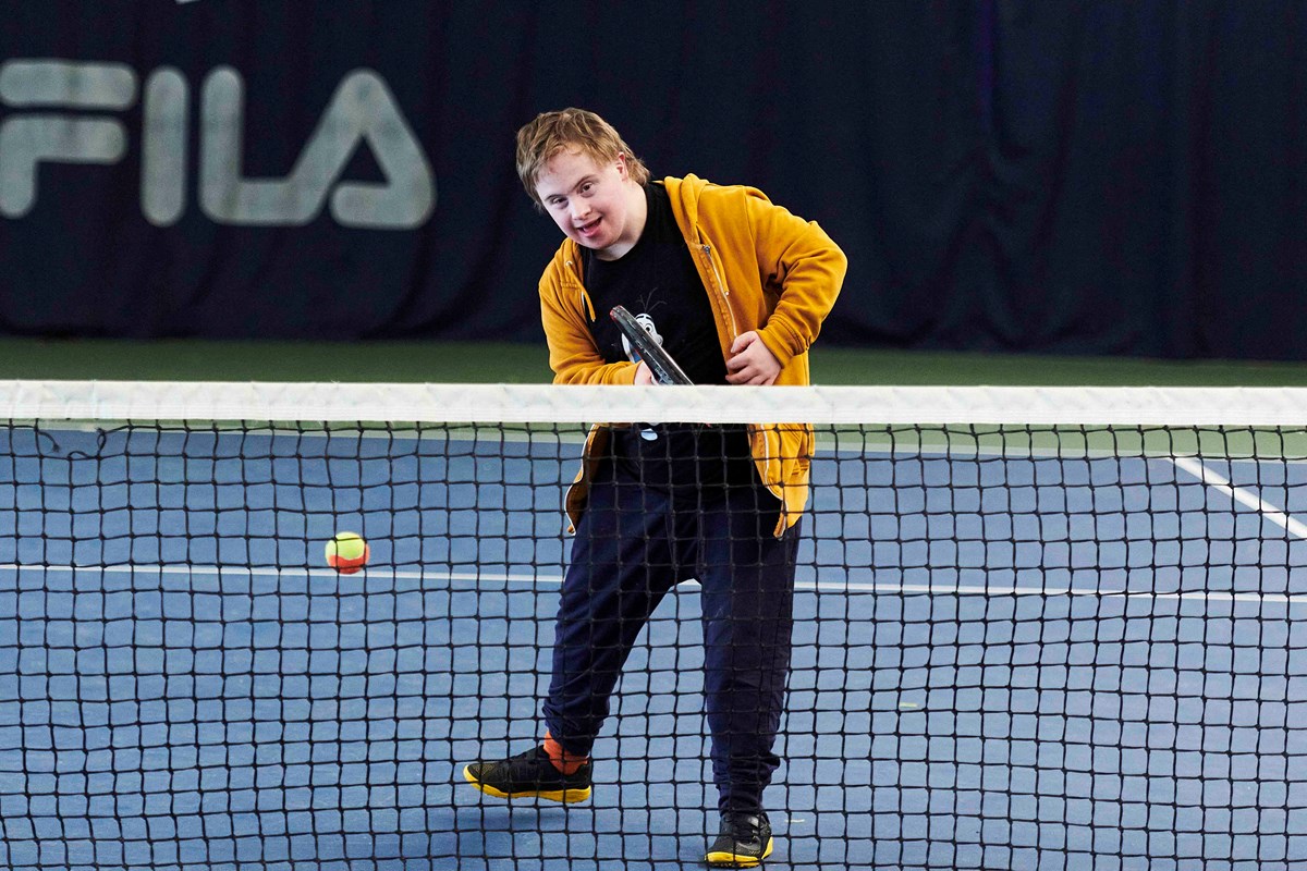 Learning disability player hitting forehand.jpg