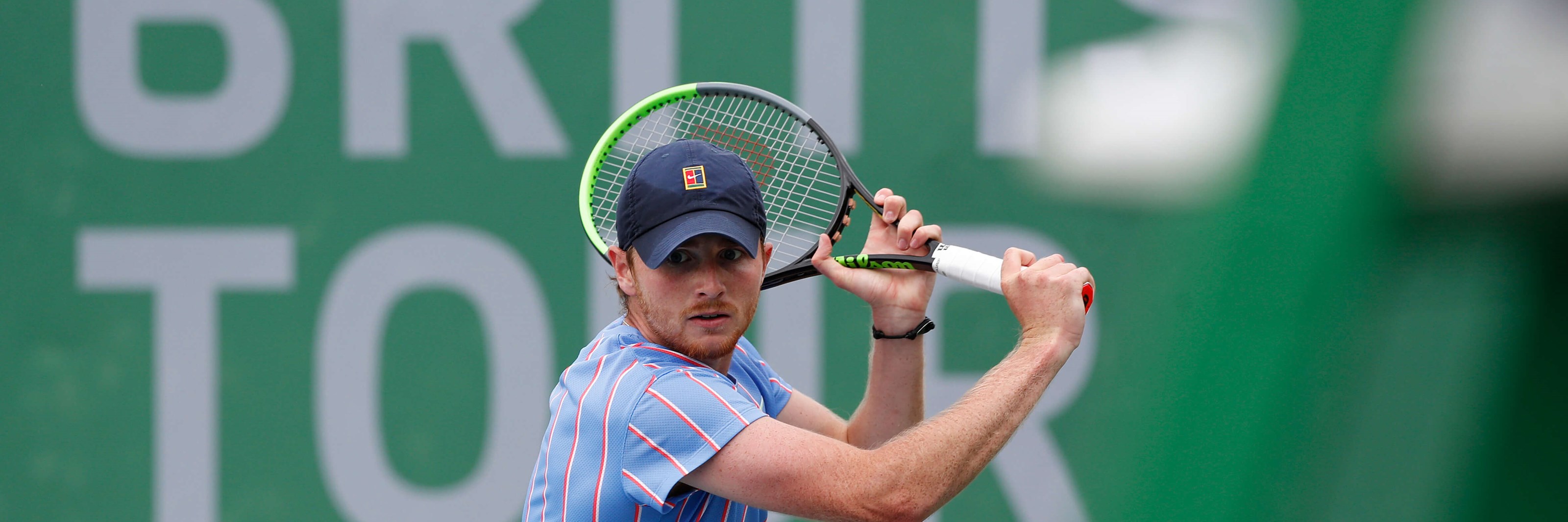 Aidan Mchugh hits a backhand during his Quarter Final match against Henry Patten during Day Two of Week Four of the British Tour at National Tennis Centre on July 24, 2020 in London, England.
