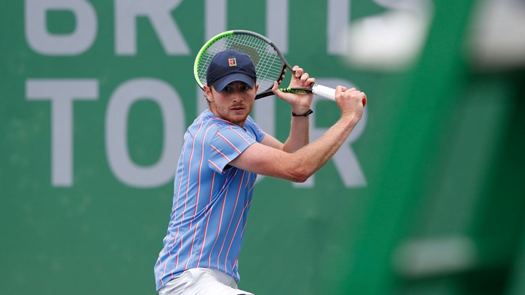 Aidan Mchugh hits a backhand during his Quarter Final match against Henry Patten during Day Two of Week Four of the British Tour at National Tennis Centre on July 24, 2020 in London, England.