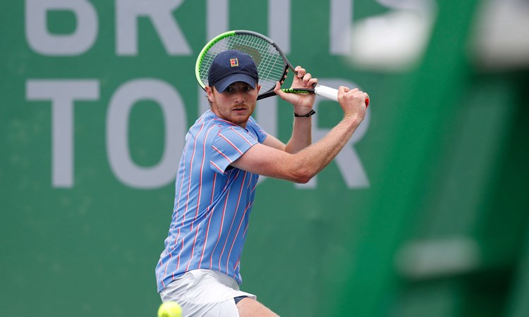 Aidan Mchugh hits a backhand during his Quarter Final match against Henry Patten during Day Two of Week Four of the British Tour at National Tennis Centre on July 24, 2020 in London, England.
