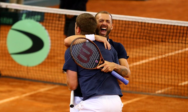 Dan Evans and Neal Skupski celebrate a victory at the Davis Cup Finals Qualifiers in Colombia
