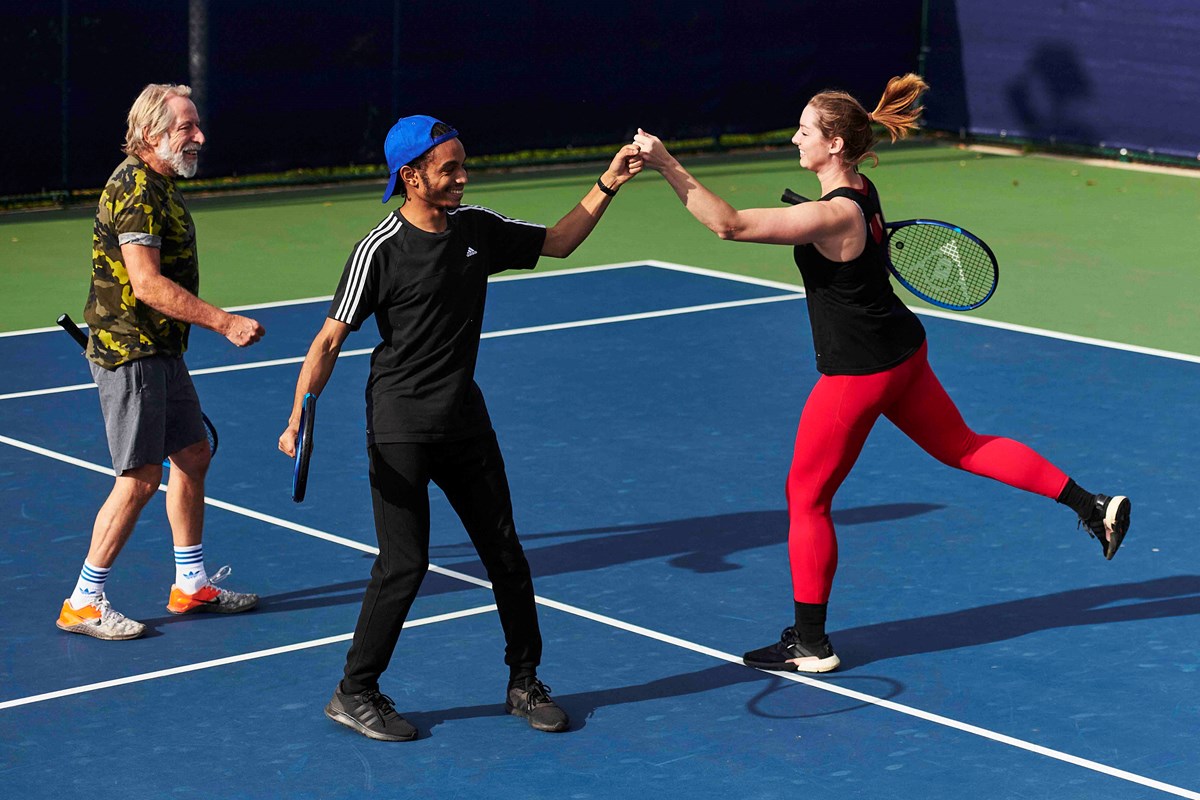 Players fist bumping on court.jpg