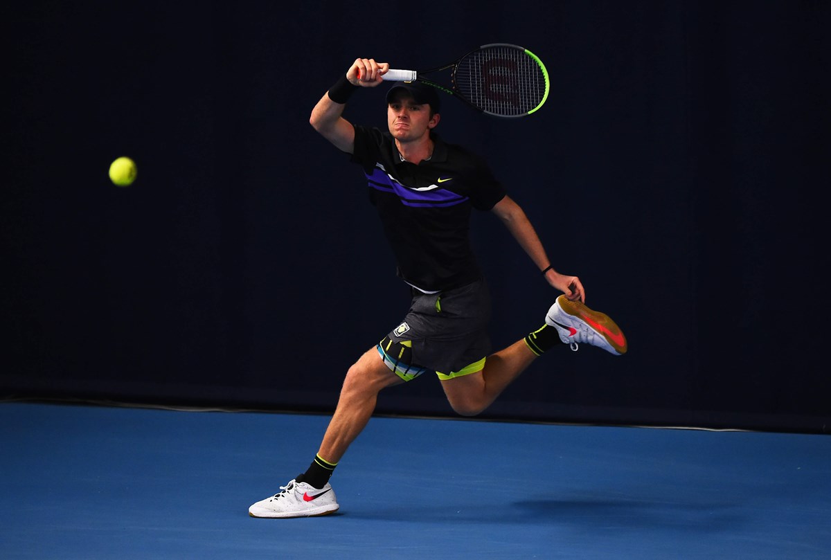 Aidan McHugh plays a forehand.jpg