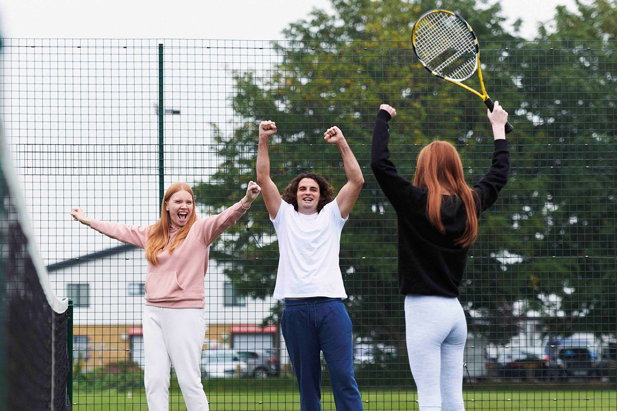 Kids and parents celebrating a winning shot.jpg