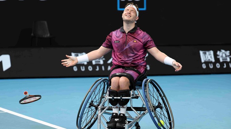 Alfie Hewett drops his racket to the ground as he wins the Australian Open wheelchair singles title