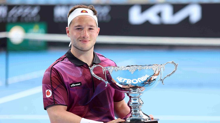 Alfie Hewett holding his Australian Open wheelchair singles trophy