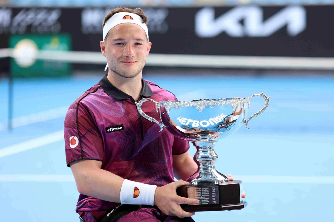 Alfie Hewett holding his Australian Open wheelchair singles trophy