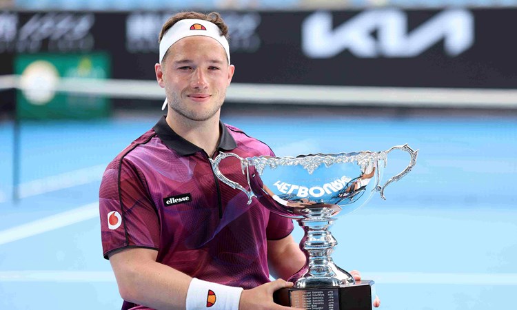 Alfie Hewett holding his Australian Open wheelchair singles trophy