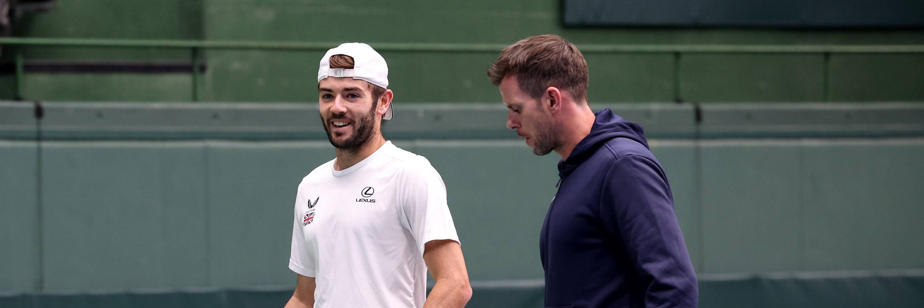 Jacob Fearnley and Leon Smith laughing on court at the Davis Cup in Japan