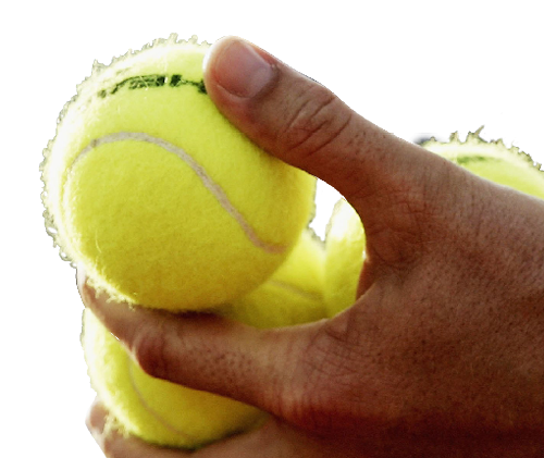 Cut out of tennis balls being held by a person