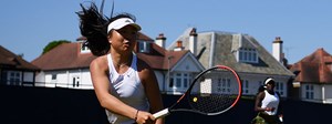 Mingge Xu playing tennis at a tournament