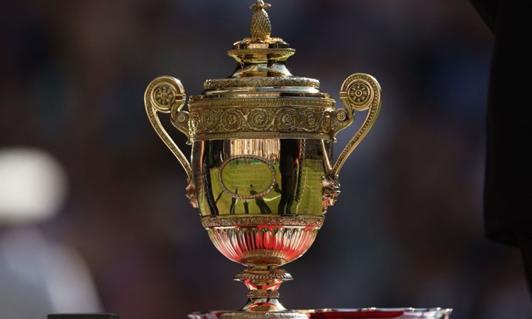 The Wimbledon men's singles trophy sitting on a table outside