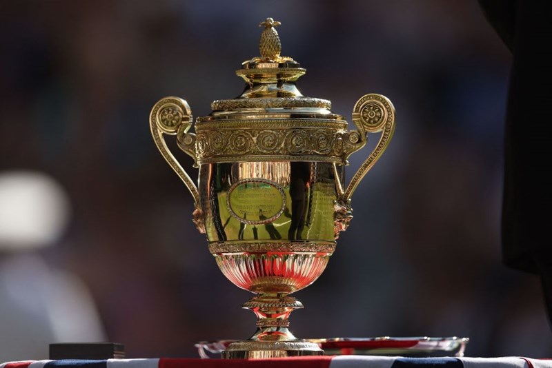 The Wimbledon men's singles trophy sitting on a table outside