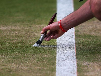 Painting the lines on a tennis court