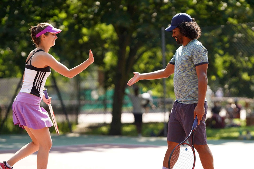 Competition players high-fiving during a match