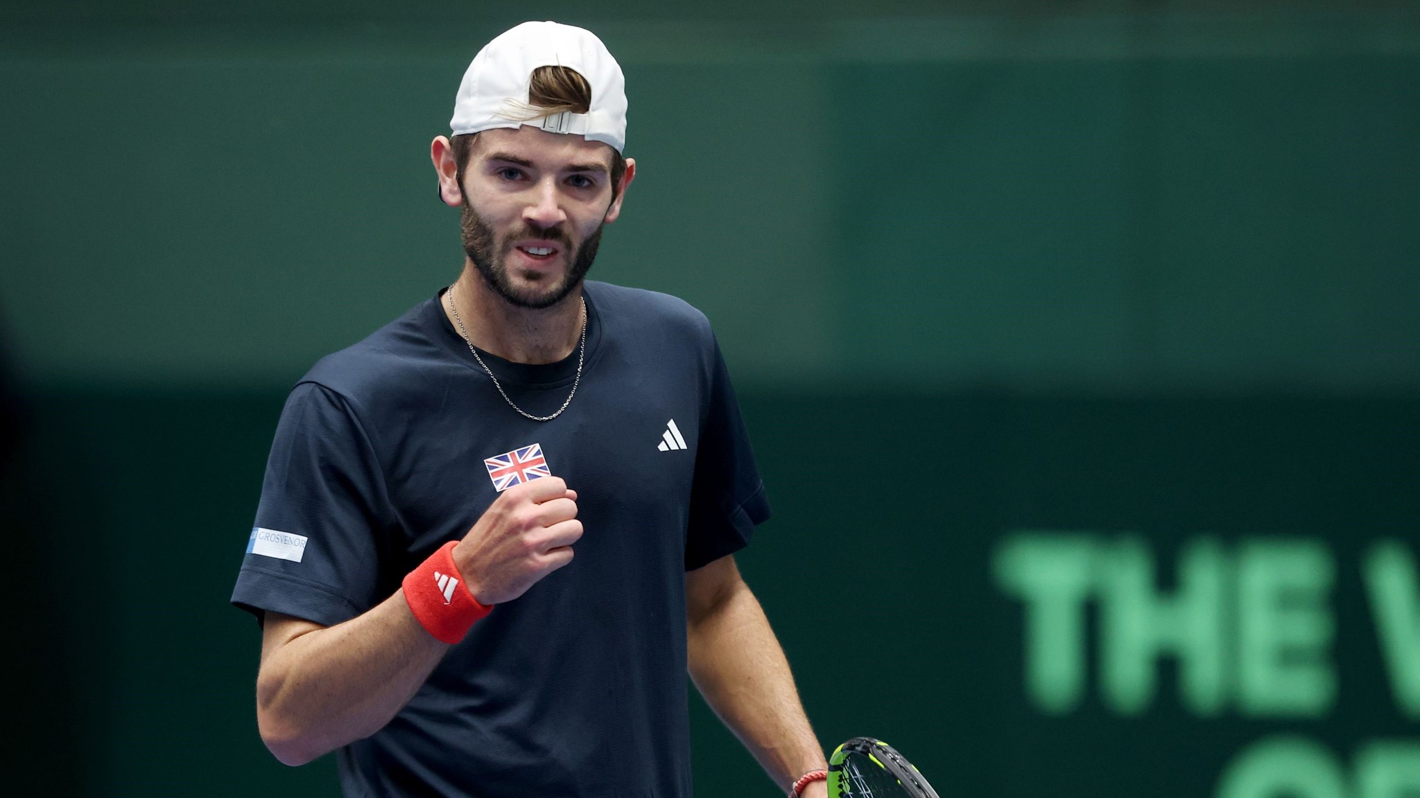 Jacob Fearnley clenching his fist in celebration in his Davis Cup debut against Japan