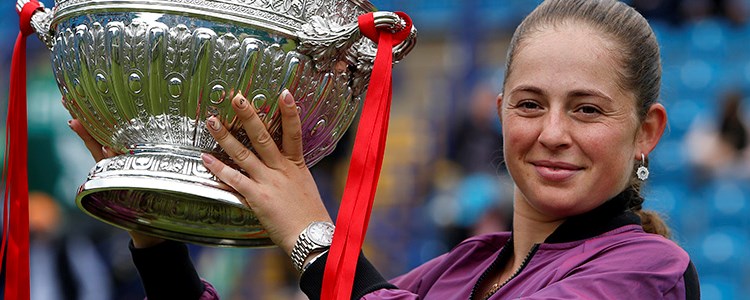 Jelena Ostapenko women's champion holding the 2021 Eastbourne trophy
