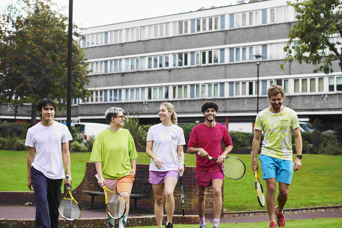 Group of tennis players heading on court.jpg