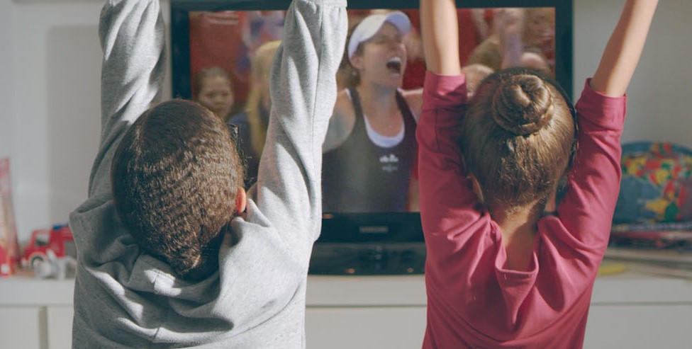 Kids cheering watching tennis on TV