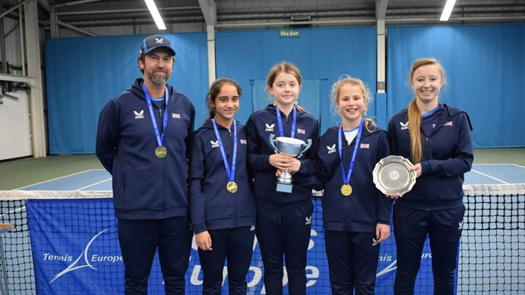 The 12U GB girls team with the Winter Cup trophy in Sunderland