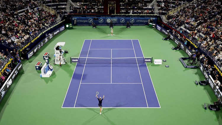 Barbora Krejcikova and Iga Swiatek on a tennis court at the Dubai Duty Free Tennis Championships final