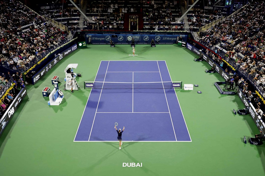 Barbora Krejcikova and Iga Swiatek on a tennis court at the Dubai Duty Free Tennis Championships final