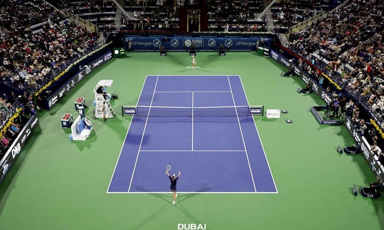 Barbora Krejcikova and Iga Swiatek on a tennis court at the Dubai Duty Free Tennis Championships final