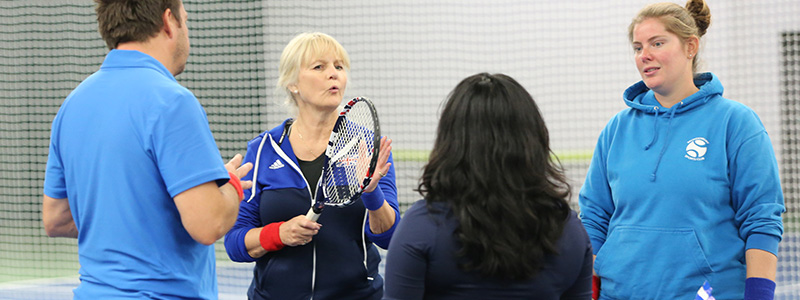 Coaches talking on court