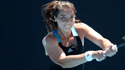 Jodie Burrage playing a double handed backhand