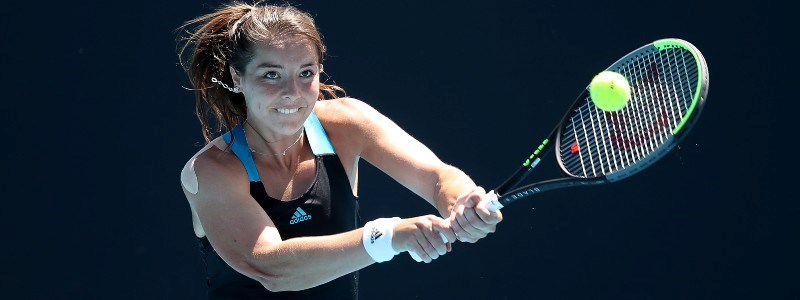 Jodie Burrage playing a double handed backhand