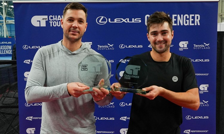 Scott Duncan and Marcus Willis holding their doubles trophies after winning the Lexus Glasgow Challenger