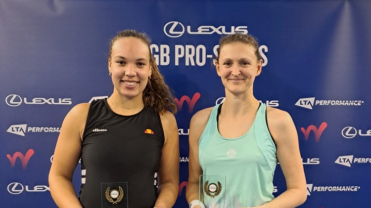 Freya Christie and Sam Murray Sharan holding their W50 Roehampton doubles titles on court