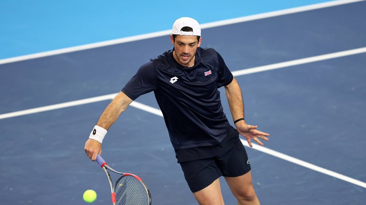 Julian Cash hits a volley in Davis Cup practice