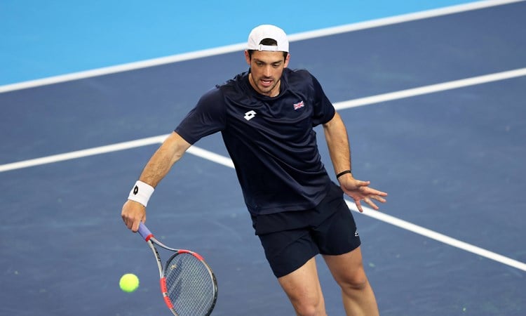 Julian Cash hits a volley in Davis Cup practice
