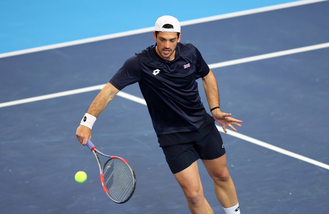 Julian Cash hits a volley in Davis Cup practice