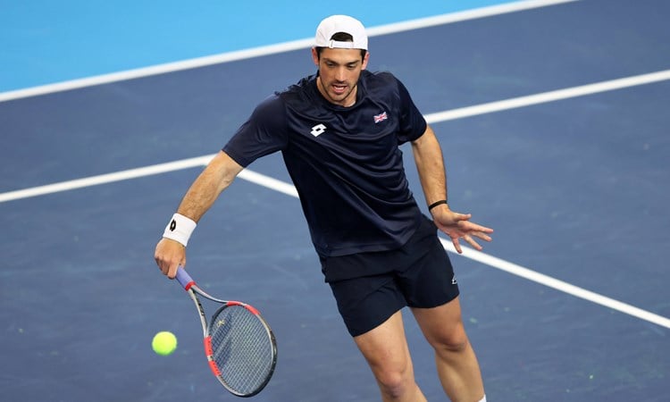 Julian Cash hits a volley in Davis Cup practice