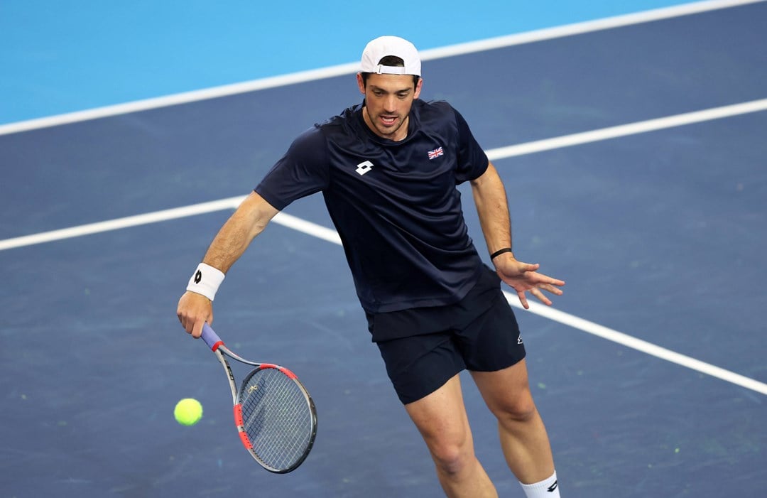 Julian Cash hits a volley in Davis Cup practice
