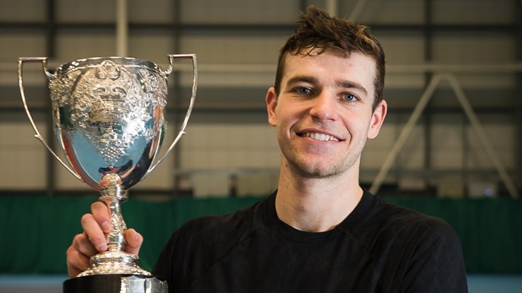 Alastair Gray holding the men's singles trophy for the Glasgow $25k.