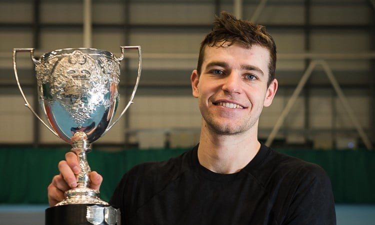 Alastair Gray holding the men's singles trophy for the Glasgow $25k.