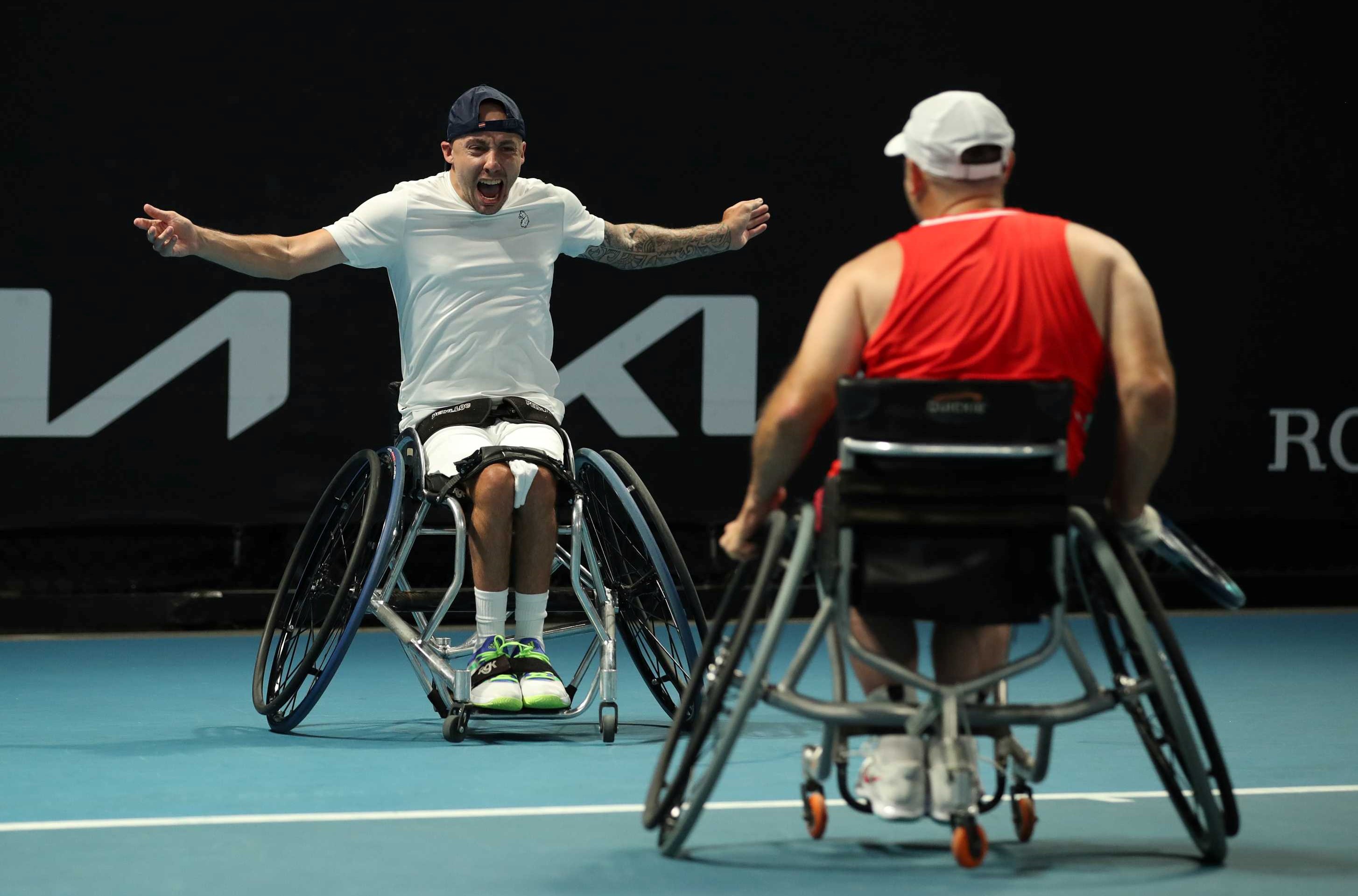 Andy Lapthorne and David Wagner celebrate winning the 2022 Australian Open Quad Doubles title