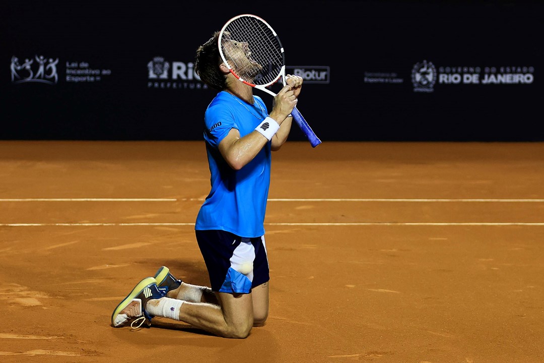 Cam Norrie collapses to his knees after winning the Rio Open