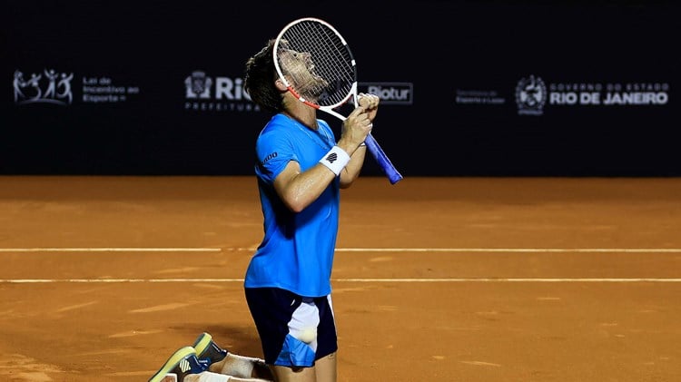 Cam Norrie collapses to his knees after winning the Rio Open